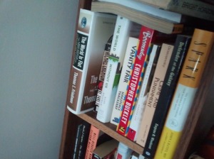 Books on a bookshelf including Boomstown